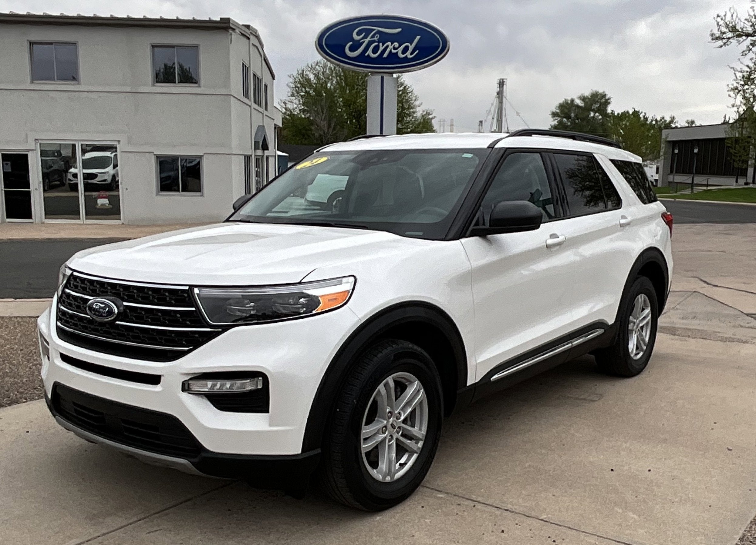 2024 Ford Explorer XLT in Star White Metallic Tri-Coat — front three-quarter view