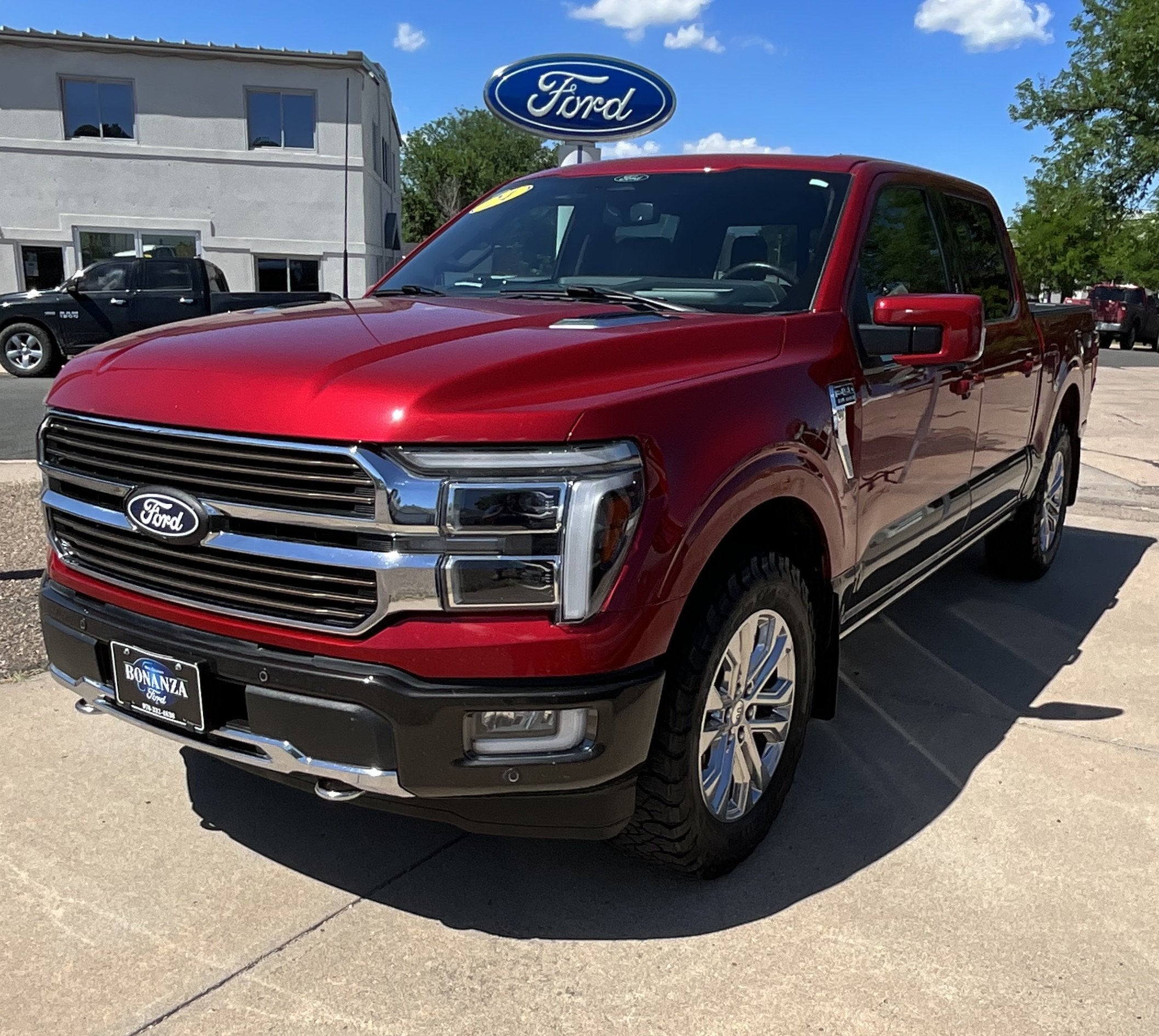 2024 Ford F-150 King Ranch in Rapid Red Metallic Tinted Clearcoat — front three-quarter view